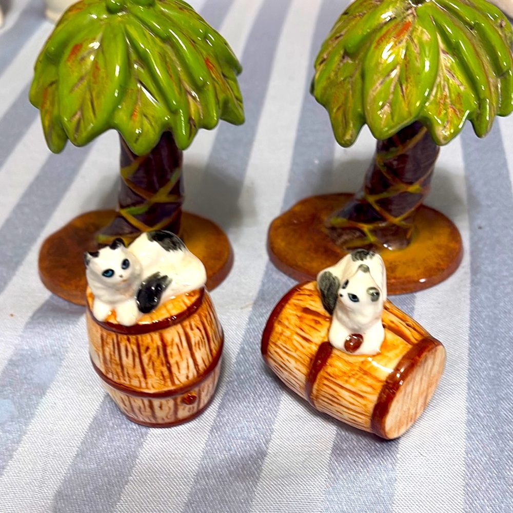 2 sets of unique salt and pepper shakers—
Palm trees and cats